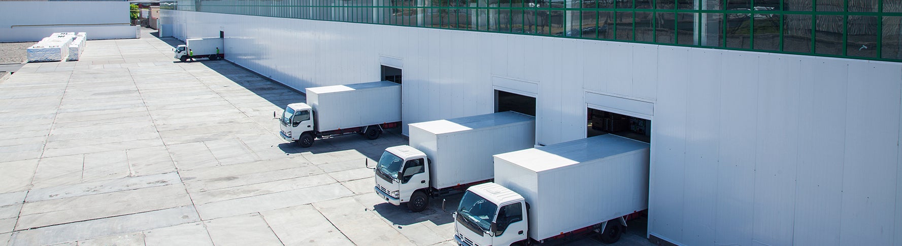 Industrial warehouse with trucks.