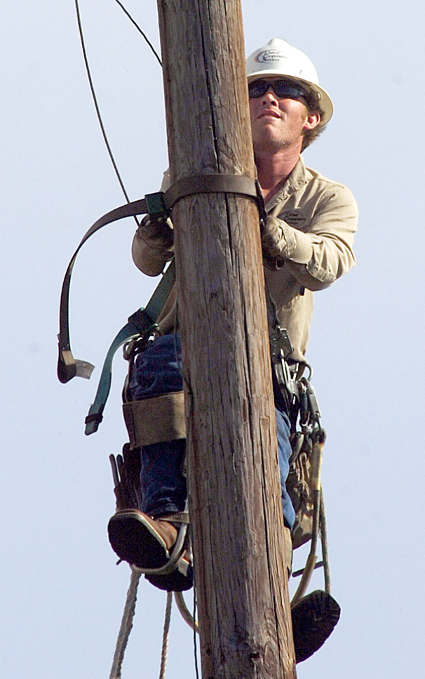 Lineman climbing a pole