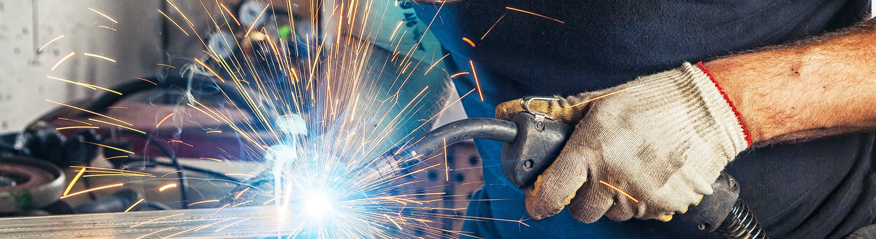 Welder welding metal.