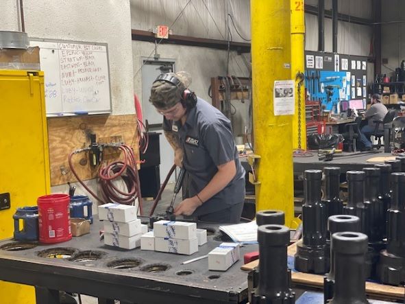 man making drill bits