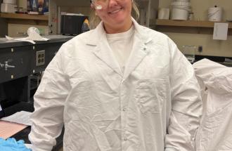 Image of woman in a lab coat in a lab