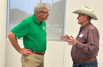 United CEO Cameron Smallwood talking with a member