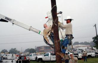 Image of lineman climbing pole rescue training