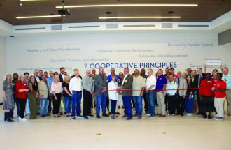 Group of people at ribbon cutting