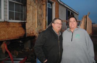 Mearl and Wendy Taylor and burned house