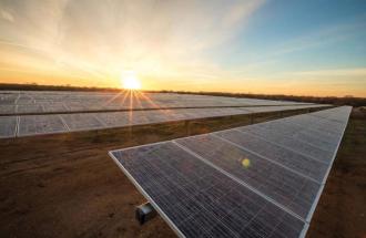 IMAGE OF SOLAR PANELS AND SUNRISE
