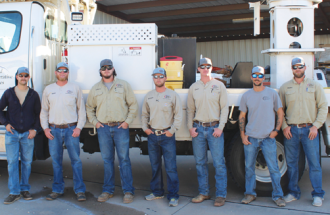 IN IT FOR THE LONG HAUL—United’s seven-man team assembled for the long drive to Central Georgia. FROM LEFT: Joshua Simmons, apprentice lineman III; Matt Simmons, first-class lineman; Emory Allen, apprentice lineman III; Morgan Bass, apprentice lineman III; Dean Koltz, apprentice lineman I; Jackie Carter, line crew chief and Blake Bourg, line crew chief. 