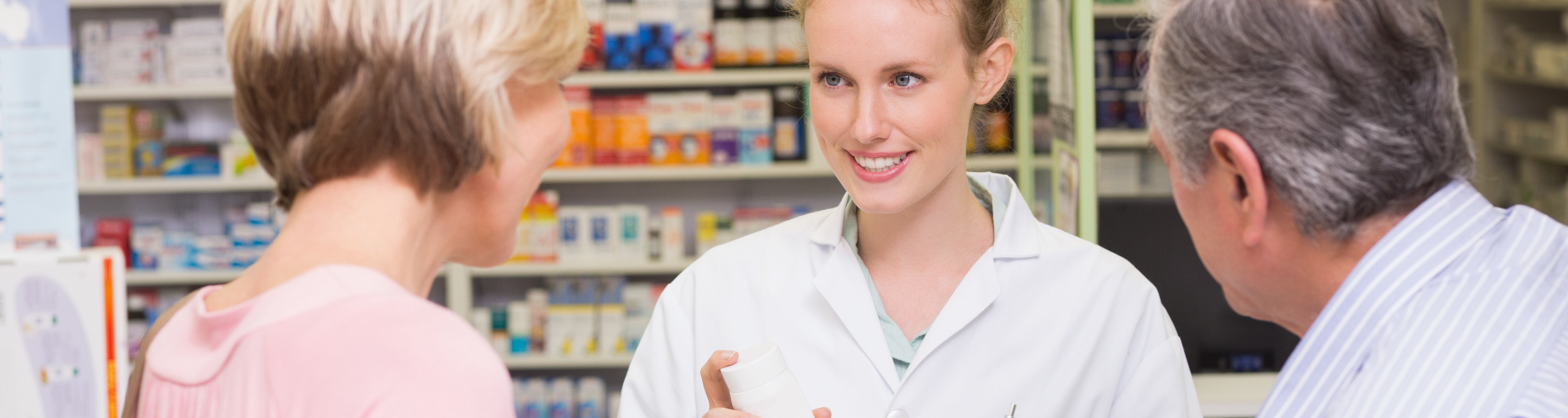 Pharmacist assisting customers